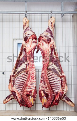 Peeled bodies of Pork Hanging showing the rib cage on the hook