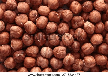 Peeled hazelnut kernels. Close-up. Texture of the nut. A vegan dish. View from above. Healthy eating. An energy product.