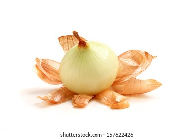 Peeled onions with husks close up on a white background.