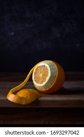 Peeled orange on a wooden board 