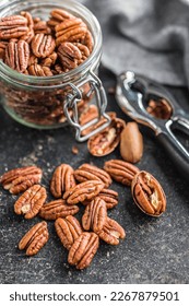 Peeled pecan nuts on the kitchen table. - Shutterstock ID 2267879501