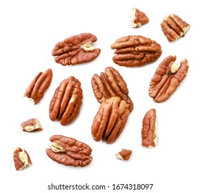 Peeled pecans with broken halves and pieces on a white background. The view from top.