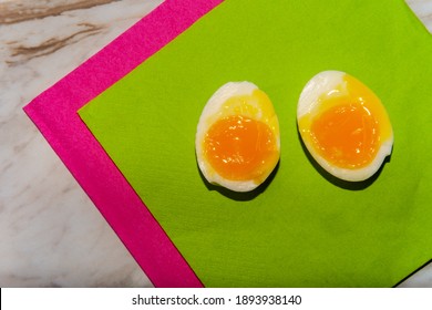 Peeled Softboiled Egg Sliced In Half Showing Runny Yolk