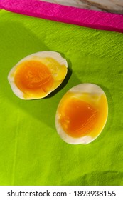 Peeled Softboiled Egg Sliced In Half Showing Runny Yolk