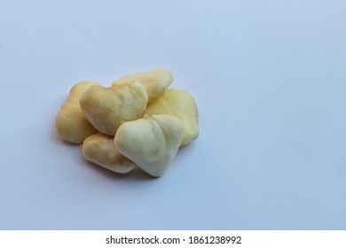 Peeled Water Chestnut Or Eleocharis Dulcis Fruit Isolated On White Background With Copy Space For Texts Writing