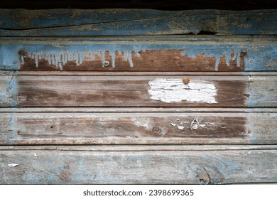 Peeling blue paint on weathered wood texture. Abstract architecture background - Powered by Shutterstock