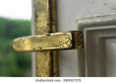 Peeling And Dull Gold Chrome Doorknob