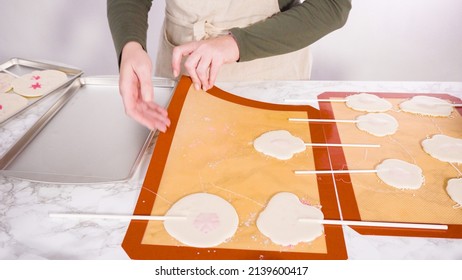 Peeling Large Homemade Lollipops From Silicone Mat.