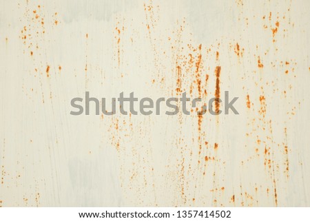 Peeling paint on an old metallic surface, texture of rusty iron. Cracked paint onrusty metal background for design with copy space.