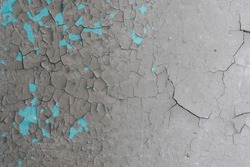 Peeling Paint On The Wall. Old Concrete Wall With Cracked Flaking Paint. Weathered Rough Painted Surface With Patterns Of Cracks And Peeling. High Resolution Texture For Background And Design. Closeup