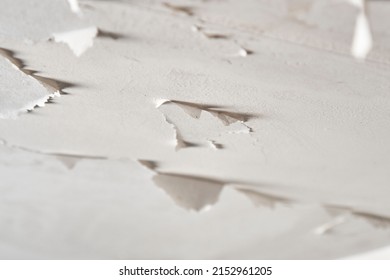 Peeling Paint In Plaster Ceiling Of Bathroom And Toilet. Moisture And Humidity In Room. Close Up