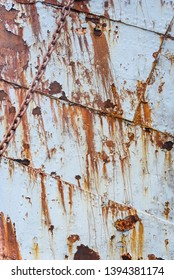 Peeling Paint And Rust Steel Hull Of An Abandoned Whaling Ship, As A Rustic Background
