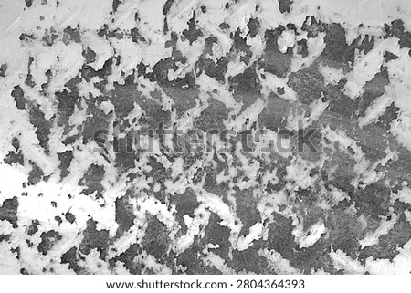 Peeling paint texture with rust and wavy grunge marks on weathered metal surface.