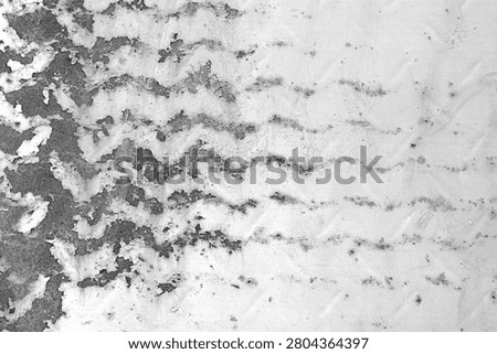 Peeling paint texture with rust and wavy grunge marks on weathered metal surface.