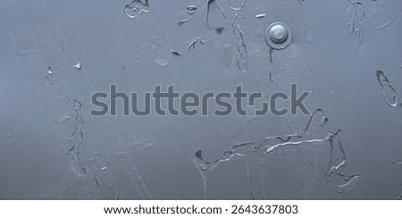 Peeling paint with visible patterns of underlying structure. Industrial wall texture showing wear, scratches, and decay.