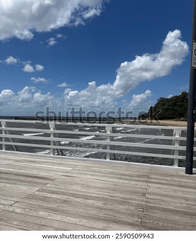 Peering through the pier at the beach below