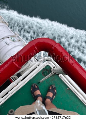 peering at the waves from inside a moving ship