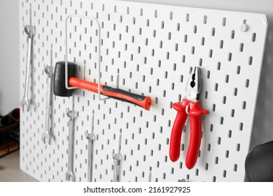 Pegboard With Pliers, Hammer And Spanners, Closeup