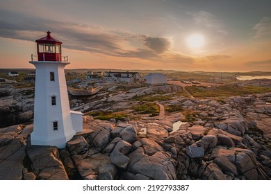 Peggy's Cove Lighthouse in Nova Scotia, Canada, taken at Sunrise with the village in the background. An iconic maritime location along the Canadian province's south shore.  - Shutterstock ID 2192793387