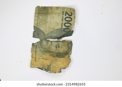 Pekalongan, Central Java - June 6 2023 : Blur and noise image of Indonesia broken money  - Shutterstock ID 2314982655