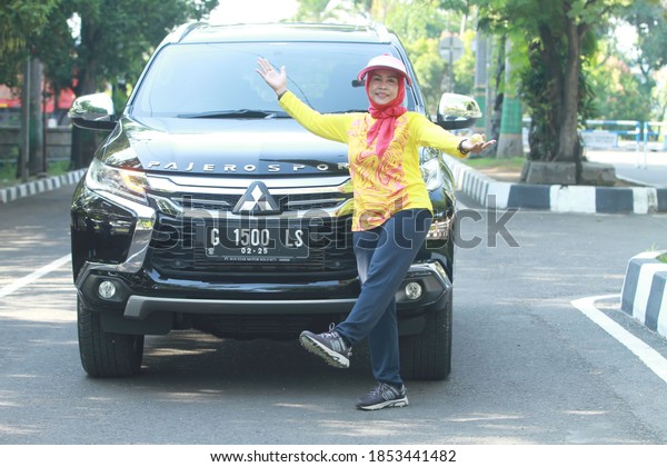 Pekalongan/Indonesia- November 11, 2020 :  Happy\
woman style  in city\
Park