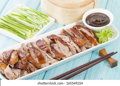 Peking Duck - Chinese Roast Crispy Duck Served With Hoisin Sauce, Pancakes, Cucumber And Spring Onions.