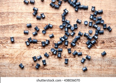 Pellet From An Air Gun, Wooden Table