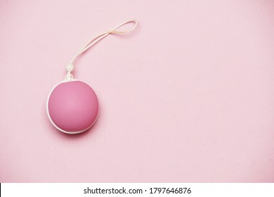 Pelvic Floor Weights And Ball On A Pink Background. Female Health Care Concept. Flat Lay Flat Design