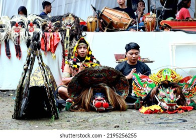 Pemalang, August 2022. Two Young Men Praying Before The Horse Braid Attraction