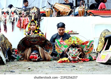 Pemalang, August 2022. Two Young Men Praying Before The Horse Braid Attraction