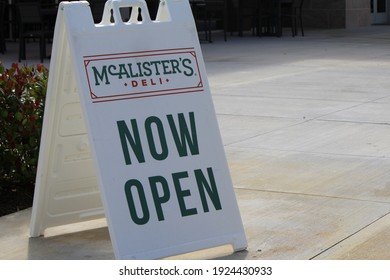 Pembroke Pines, FL, USA: Feb 24, 2021: Now Open Sign Of  McAlister's Deli. Restaurant And Sandwich Shop And Famous Sweet Tea. 