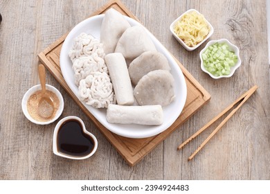 Pempek is a food made from gently ground fish meat mixed with starch or sago flour, as well as a composition of several other ingredients such as eggs, crushed garlic, flavorings and salt. - Shutterstock ID 2394924483