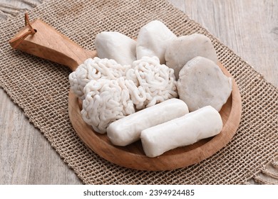 Pempek is a food made from gently ground fish meat mixed with starch or sago flour, as well as a composition of several other ingredients such as eggs, crushed garlic, flavorings and salt. - Shutterstock ID 2394924485