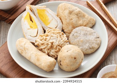 Pempek is a food made from gently ground fish meat mixed with starch or sago flour, as well as a composition of several other ingredients such as eggs, crushed garlic, flavorings and salt. - Shutterstock ID 2394924515