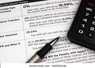 A Pen And Calculator On Top Of Credit Terms.