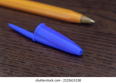 Pen caps have a small hole to prevent choking if swallowed and to equalize the pressure inside the pen to keep it from leaking.