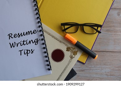 Pen And Certificate On The Table. Resume Writing Tips Concept.