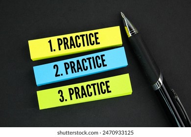 pen and colored paper with three repetitions of the words practice, practice and practice. consistent concept