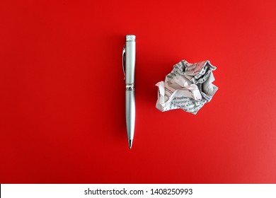 A Pen And A Crumpled Paper On Red Background With Copy Space On The Left. Concept Of First Time Writting / Writers Block/ Journey To Be A Good Writer.