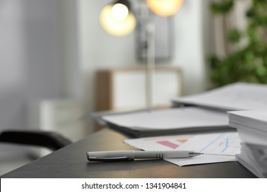Pen and different documents on office table. Space for text