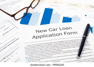 Pen, Glasses And New Car Loan Application Form On Desktop In Business Office.