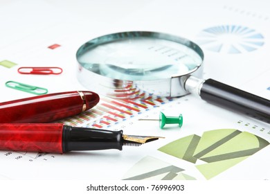 pen, magnifying glass and the working paper with a diagram - Powered by Shutterstock