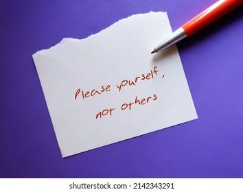 Pen and note on purple background with handwritten text PLEASE YOURSELF, NOT OTHERS - concept of stop people-pleasing, approval addiction, stop pleasing others but yourself - Shutterstock ID 2142343291