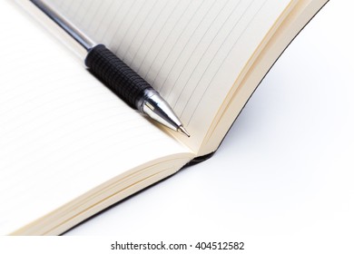 Pen and notebook close up