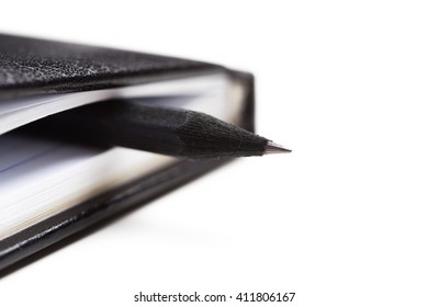 Pen and notebook close up