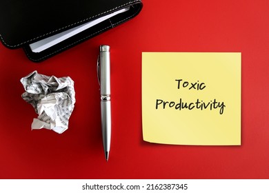 Pen Notebook And Crumpled With Handwritten Note TOXIC PRODUCTIVITY, Means Desire For Productivity At All Times, Inability To Stop Working And Take Adequate Time To Rest And Recharge