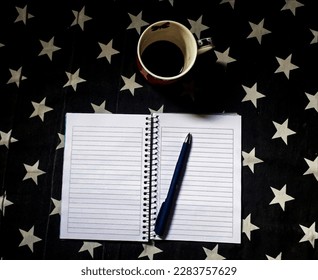 Pen, notebook, mug for work notes


