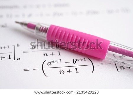 Pen on mathematic formula exercise test paper in education school.