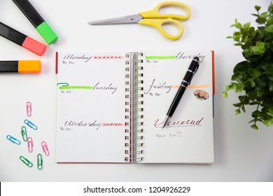 Pen on a self made planner. Modern office desk. Working, writing concept