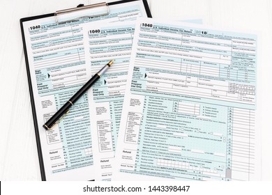 Pen On US TAX Form Background. Tax Day Concept